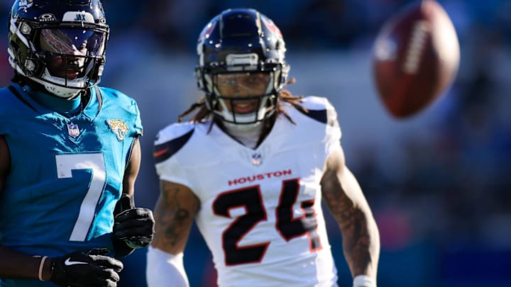 A pass intended for Jacksonville Jaguars wide receiver Brian Thomas Jr. (7) sails long against Houston Texans cornerback Derek Stingley Jr. (24) during the fourth quarter of an NFL football matchup Sunday, Dec. 1, 2024 at EverBank Stadium in Jacksonville, Fla. The Texans held off the Jaguars 23-20. [Corey Perrine/Florida Times-Union]