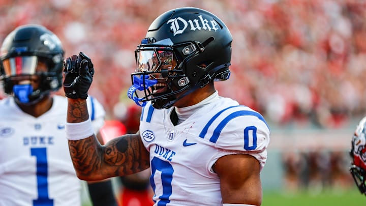 Nov 9, 2024; Raleigh, North Carolina, USA; Duke Blue Devils cornerback Chandler Rivers (0) celebrates a blocked touchdown during the first half of the game against North Carolina State Wolfpack at Carter-Finley Stadium. Mandatory Credit: Jaylynn Nash-Imagn Images Nov 9, 2024; Raleigh, North Carolina, USA; Duke Blue Devils cornerback Chandler Rivers (0) celebrates a blocked touchdown during the first half of the game against North Carolina State Wolfpack at Carter-Finley Stadium. Mandatory Credit: Jaylynn Nash-Imagn Images