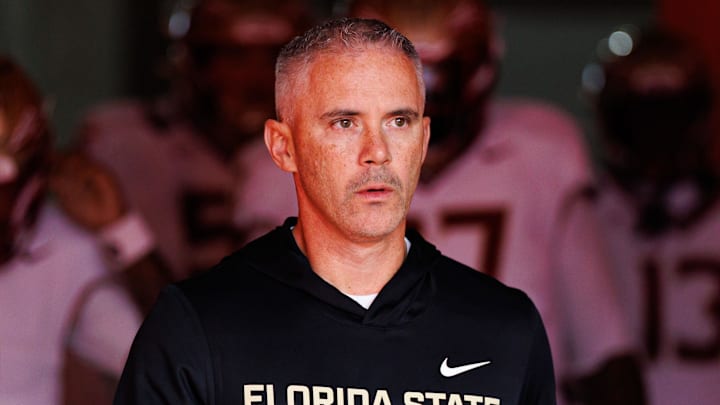 Nov 29, 2025; Gainesville, Florida, USA; Florida State Seminoles head coach Mike Norvell walks out of the tunnel before a game against the Florida Gators at Ben Hill Griffin Stadium. Mandatory Credit: Matt Pendleton-Imagn Images
