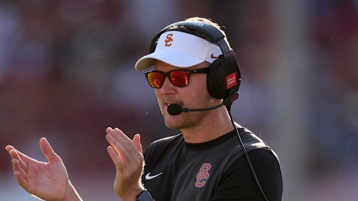 Aug 30, 2025; Los Angeles, California, USA; Southern California Trojans head coach Lincoln Riley watches from the sidelines against the Missouri State Bears in the first half at United Airlines Field at Los Angeles Memorial Coliseum. Mandatory Credit: Kirby Lee-Imagn Images