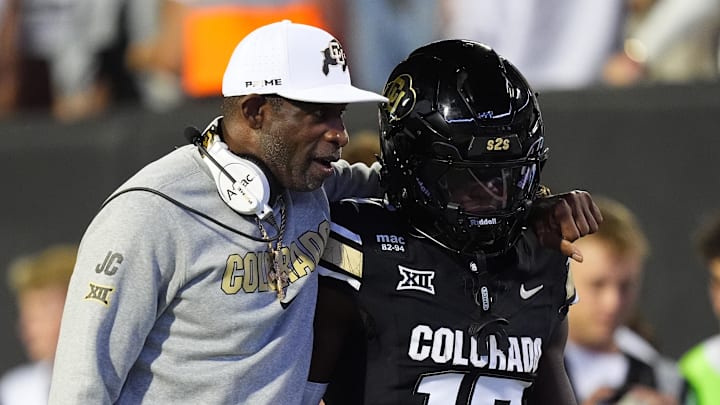 Sep 20, 2025; Boulder, Colorado, USA; Colorado Buffaloes head coach Deion Sanders and wide receiver Isaiah Hardge (17) during the first quarter against the Wyoming Cowboys at Folsom Field. Mandatory Credit: Ron Chenoy-Imagn Images