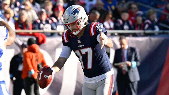 Nov 17, 2024; Foxborough, Massachusetts, USA; New England Patriots punter Bryce Baringer (17) punts the ball against the Los Angeles Rams during the first half at Gillette Stadium. Mandatory Credit: Eric Canha-Imagn Images