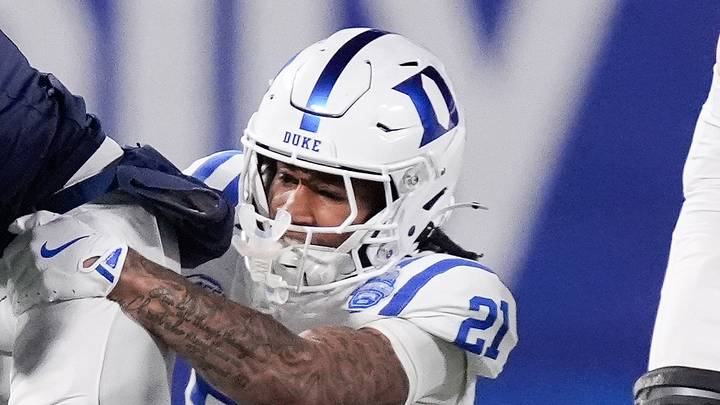 Dec 6, 2025; Charlotte, NC, USA; Virginia Cavaliers wide receiver Jahmal Edrine (7) is brought down by Duke Blue Devils cornerback Landan Callahan (21) in the second quarter during the 2025 ACC Championship game at Bank of America Stadium. Mandatory Credit: Jim Dedmon-Imagn Images Dec 6, 2025; Charlotte, NC, USA; Virginia Cavaliers wide receiver Jahmal Edrine (7) is brought down by Duke Blue Devils cornerback Landan Callahan (21) in the second quarter during the 2025 ACC Championship game at Bank of America Stadium. Mandatory Credit: Jim Dedmon-Imagn Images