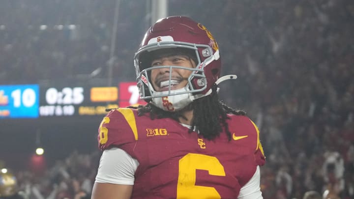 Nov 29, 2025; Los Angeles, California, USA; Southern California Trojans wide receiver Makai Lemon (6) celebrates after catching a 32-yard touchdown pass against the UCLA Bruins in the second half at United Airlines Field at Los Angeles Memorial Coliseum. Mandatory Credit: Kirby Lee-Imagn Images
