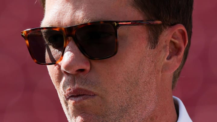 Sep 28, 2025; Tampa, Florida, USA; Fox Sports broadcaster Tom Brady looks on from the field before the game between Philadelphia Eagles and Tampa Bay Buccaneers at Raymond James Stadium. Mandatory Credit: Nathan Ray Seebeck-Imagn Images Sep 28, 2025; Tampa, Florida, USA; Fox Sports broadcaster Tom Brady looks on from the field before the game between Philadelphia Eagles and Tampa Bay Buccaneers at Raymond James Stadium. Mandatory Credit: Nathan Ray Seebeck-Imagn Images