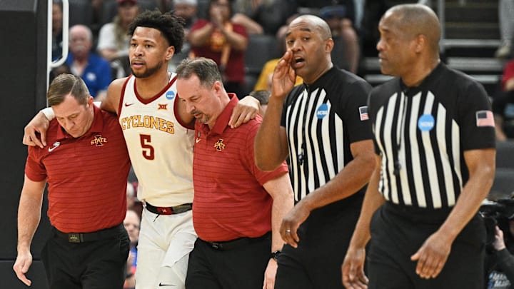Mar 20, 2026; St. Louis, MO, USA; Iowa State Cyclones forward Joshua Jefferson (5) is helped off of the court after suffering an apparent injury to his left leg while shooting a layup against Tennessee State Tigers forward Jalen Pitre (not pictured) during the first half of a first round game of the men's 2026 NCAA Tournament at Enterprise Center. Mar 20, 2026; St. Louis, MO, USA; Iowa State Cyclones forward Joshua Jefferson (5) is helped off of the court after suffering an apparent injury to his left leg while shooting a layup against Tennessee State Tigers forward Jalen Pitre (not pictured) during the first half of a first round game of the men's 2026 NCAA Tournament at Enterprise Center.
