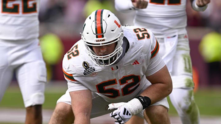 Dec 20, 2025; College Station, TX, USA; Miami Hurricanes offensive lineman James Brockermeyer (52) gets into position during the game between the Aggies and the Hurricanes at Kyle Field. Mandatory Credit: Jerome Miron-Imagn Images