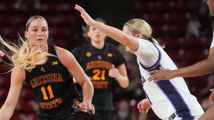ASU Sun Devils guard Marley Washenitz (11) brings the ball up court as Kansas State Wildcats guard Taryn Sides (11) defends at Desert Financial Arena in Tempe on Feb. 1, 2026. ASU Sun Devils guard Marley Washenitz (11) brings the ball up court as Kansas State Wildcats guard Taryn Sides (11) defends at Desert Financial Arena in Tempe on Feb. 1, 2026.