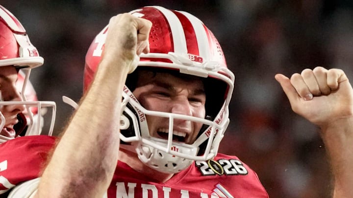 Indiana Hoosiers quarterback Fernando Mendoza (15) celebrates with his teammates after rushing for a touchdown Monday, Jan. 19, 2026, during the College Football Playoff National Championship college football game at Hard Rock Stadium in Miami Gardens.