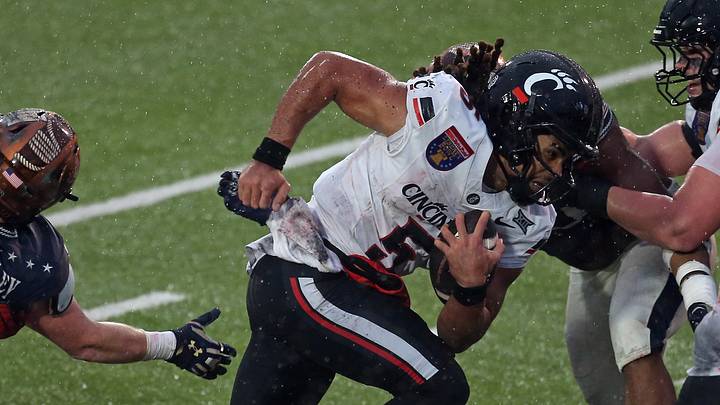 Jan 2, 2026; Memphis, TN, USA; Cincinnati Bearcats quarterback Samaj Jones (5) runs the ball during the second quarter against the Navy Midshipmen at Simmons Bank Liberty Stadium. Mandatory Credit: Petre Thomas-Imagn Images Jan 2, 2026; Memphis, TN, USA; Cincinnati Bearcats quarterback Samaj Jones (5) runs the ball during the second quarter against the Navy Midshipmen at Simmons Bank Liberty Stadium. Mandatory Credit: Petre Thomas-Imagn Images