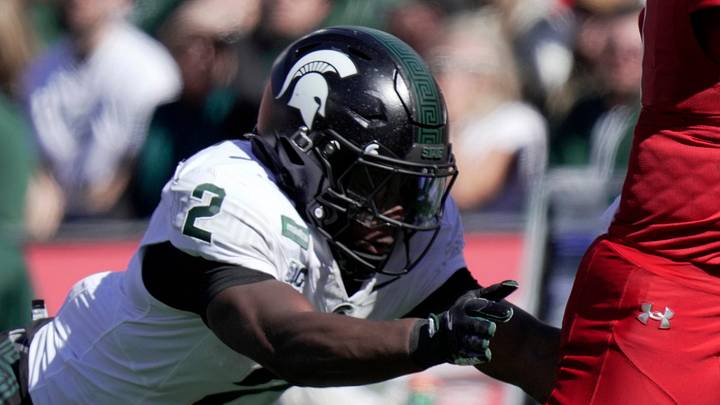Wisconsin quarterback Colton Joseph (1) avoids a tackle by Michigan State defensive back Devin Vaught (2) on a 47-yard touchdown run during the third quarter of their game Saturday, October 3, 2026 at Camp Randall Stadium in Madison, Wisconsin.