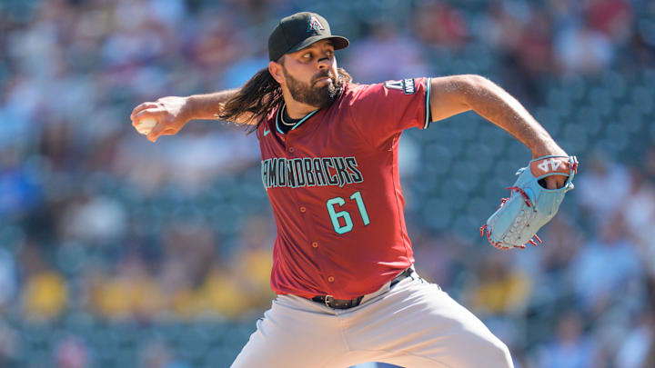 Sep 14, 2025; Minneapolis, Minnesota, USA; Arizona Diamondbacks pitcher Nabil Crismatt (61) pitches to Minnesota Twins second base Edouard Julien (47) in the fourth inning at Target Field. Mandatory Credit: Matt Blewett-Imagn Images