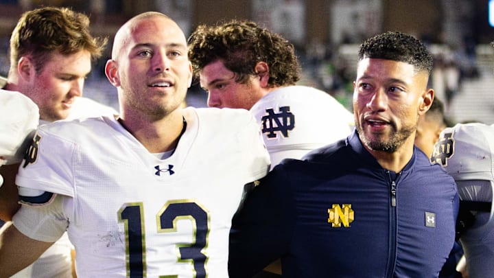 Notre Dame Fighting Irish coach Marcus Freeman and quarterback CJ Carr (13) after defeating the Boston College Eagles at Alumni Stadium. 