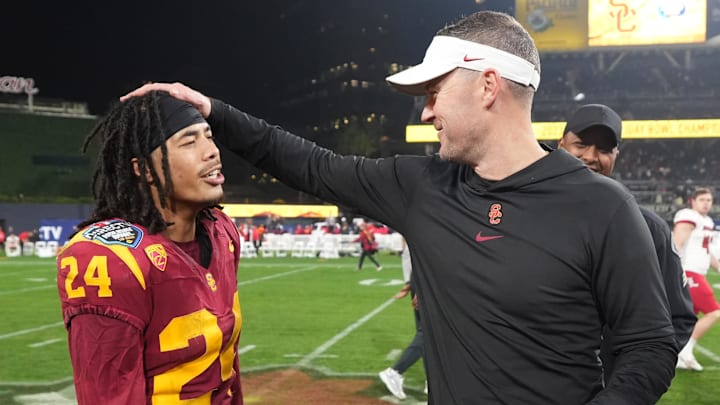 Dec 27, 2023; San Diego, CA, USA; Southern California Trojans head coach Lincoln Riley (right) celebrates with wide receiver Makai Lemon (24) after the Holiday Bowl against the Louisville Cardinals at Petco Park. Mandatory Credit: Kirby Lee-Imagn Images