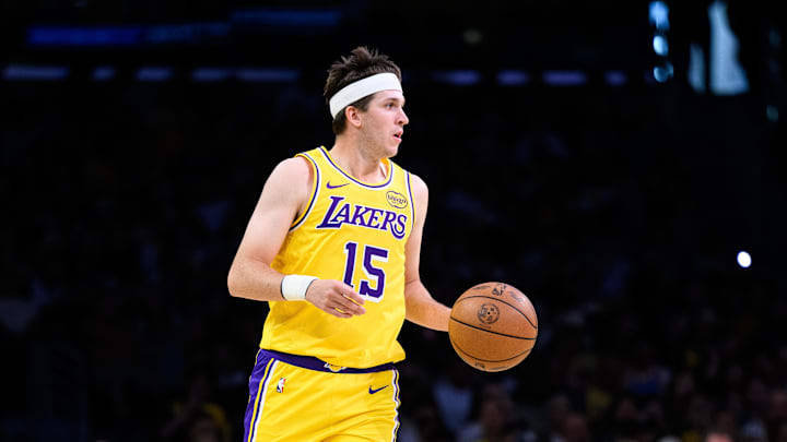 Mar 14, 2026; Los Angeles, California, USA; Los Angeles Lakers guard Austin Reaves (15) controls the ball during the first half against the Denver Nuggets at Crypto.com Arena. Mandatory Credit: William Liang-Imagn Images