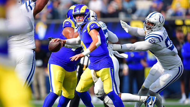 Sep 28, 2025; Inglewood, California, USA; Los Angeles Rams quarterback Matthew Stafford (9) runs out to pass as Indianapolis Colts defensive tackle Deforest Buckner (99) moves in during the second half at SoFi Stadium. Mandatory Credit: Gary A. Vasquez-Imagn Images Sep 28, 2025; Inglewood, California, USA; Los Angeles Rams quarterback Matthew Stafford (9) runs out to pass as Indianapolis Colts defensive tackle Deforest Buckner (99) moves in during the second half at SoFi Stadium. Mandatory Credit: Gary A. Vasquez-Imagn Images