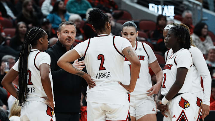 Louisville head coach Jeff Walz instructed his team against Oklahoma during their game at the KFC Yum! Center in Louisville, Ky. on Dec. 4, 2024.
