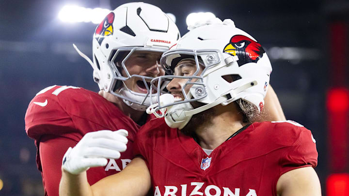 Aug 23, 2025; Glendale, Arizona, USA; Arizona Cardinals wide receiver Simi Fehoko (80) celebrates a touchdown with teammate Travis Vokolek (81) against the Las Vegas Raiders during a preseason NFL game at State Farm Stadium. Mandatory Credit: Mark J. Rebilas-Imagn Images
