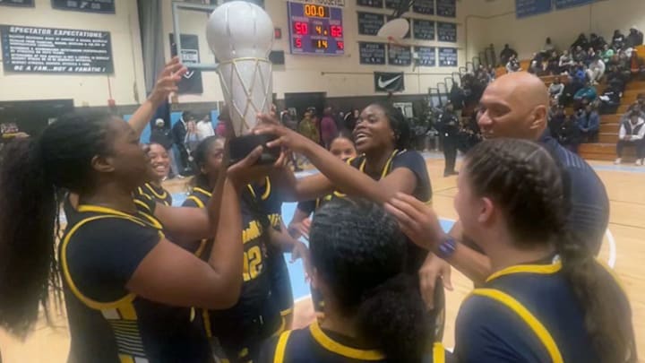 Bullis School girls basketball team hoist after Friday evening’s Maryland Private School state tournament championship game. The No. 2 Bulldogs toppled defending champ and top-ranked Bishop McNamara at Eleanor Roosevelt High.