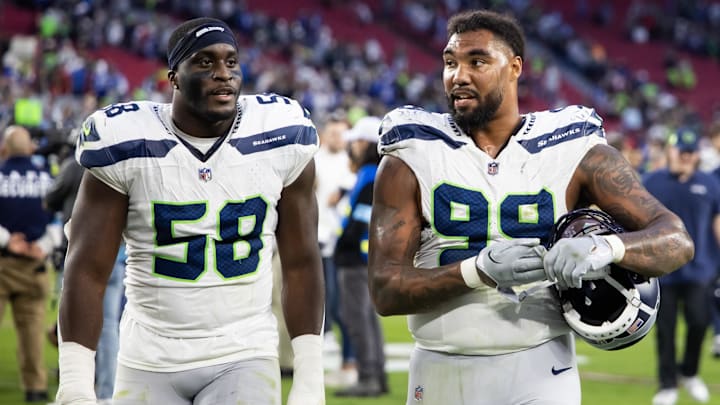 Dec 8, 2024; Glendale, Arizona, USA; Seattle Seahawks linebacker Derick Hall (58) and defensive end Leonard Williams (99) against the Arizona Cardinals at State Farm Stadium.