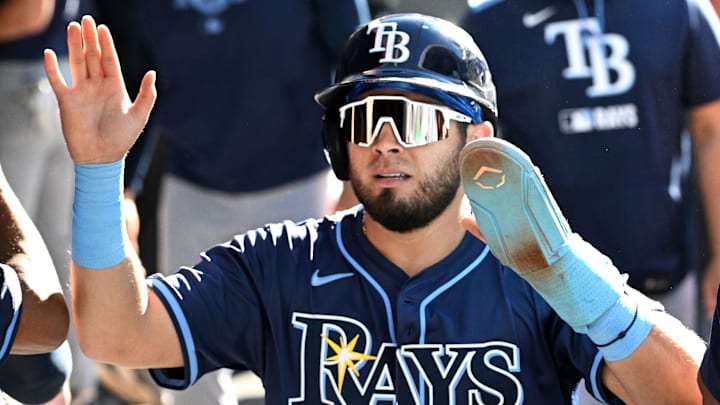Sep 28, 2025; Toronto, Ontario, CAN;  Tampa Bay Rays designated hitter Jonathan Aranda (62) celebrates in the dugout after scoring a run against the Toronto Blue Jays in the third inning at Rogers Centre. 