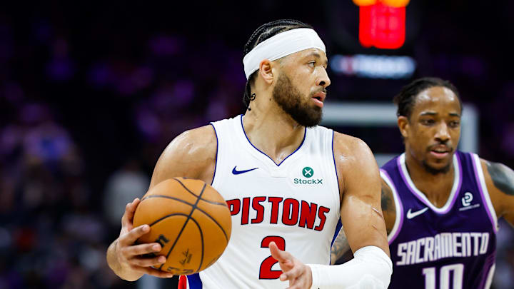 Dec 23, 2025; Sacramento, California, USA; Detroit Pistons guard Cade Cunningham (2) dribbles past Sacramento Kings guard Demar Derozan (10) during the second quarter at Golden 1 Center.