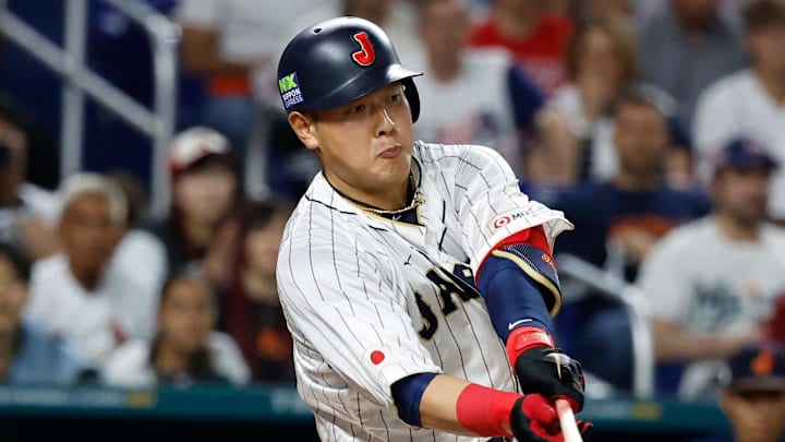 Mar 21, 2023; Miami, Florida, USA; Japan first baseman Kazuma Okamoto (25) bats against the USA in the sixth inning at LoanDepot Park. Mandatory Credit: Rhona Wise-Imagn Images