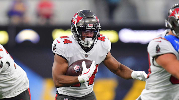 Dec 15, 2024; Inglewood, California, USA; Tampa Bay Buccaneers running back Sean Tucker (44) runs the ball against the Los Angeles Chargers during the second half at SoFi Stadium. Mandatory Credit: Gary A. Vasquez-Imagn Images