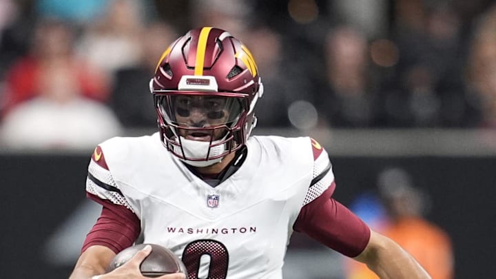Washington Commanders quarterback Marcus Mariota scrambles during the second half against the Atlanta Falcons.
