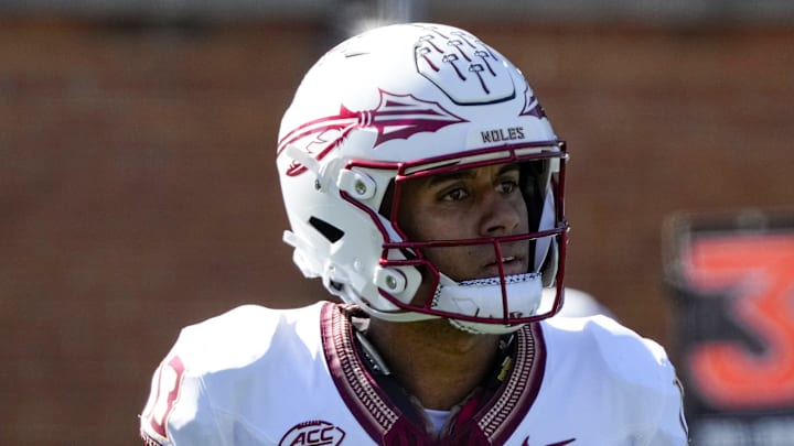 Oct 28, 2023; Winston-Salem, North Carolina, USA; Florida State Seminoles quarterback Jordan Travis (13) and running back Caziah Holmes (26) walk to the sidelines on a timeout during the first half against the Wake Forest Demon Deacons at Allegacy Federal Credit Union Stadium. Mandatory Credit: Jim Dedmon-Imagn Images Oct 28, 2023; Winston-Salem, North Carolina, USA; Florida State Seminoles quarterback Jordan Travis (13) and running back Caziah Holmes (26) walk to the sidelines on a timeout during the first half against the Wake Forest Demon Deacons at Allegacy Federal Credit Union Stadium. Mandatory Credit: Jim Dedmon-Imagn Images