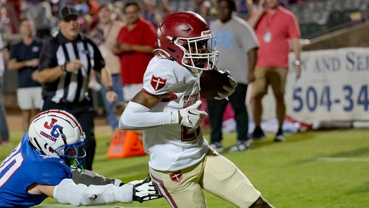 Oct 27, 2023; Metairie, LA, USA; Brother Martin Crusaders wide receiver Easton Royal (23) scores a touchdown against John Curtis Patriots linebacker Benjamin Barron (30) during the first quarter at The Shrine on Airline. Mandatory Credit: Matthew Hinton-USA TODAY Sports Oct 27, 2023; Metairie, LA, USA; Brother Martin Crusaders wide receiver Easton Royal (23) scores a touchdown against John Curtis Patriots linebacker Benjamin Barron (30) during the first quarter at The Shrine on Airline. Mandatory Credit: Matthew Hinton-USA TODAY Sports