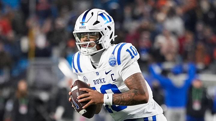 Dec 6, 2025; Charlotte, NC, USA; Duke Blue Devils quarterback Darian Mensah (10) looks to pass during over time against the Virginia Cavaliers during the 2025 ACC Championship game at Bank of America Stadium. Mandatory Credit: Jim Dedmon-Imagn Images Dec 6, 2025; Charlotte, NC, USA; Duke Blue Devils quarterback Darian Mensah (10) looks to pass during over time against the Virginia Cavaliers during the 2025 ACC Championship game at Bank of America Stadium. Mandatory Credit: Jim Dedmon-Imagn Images