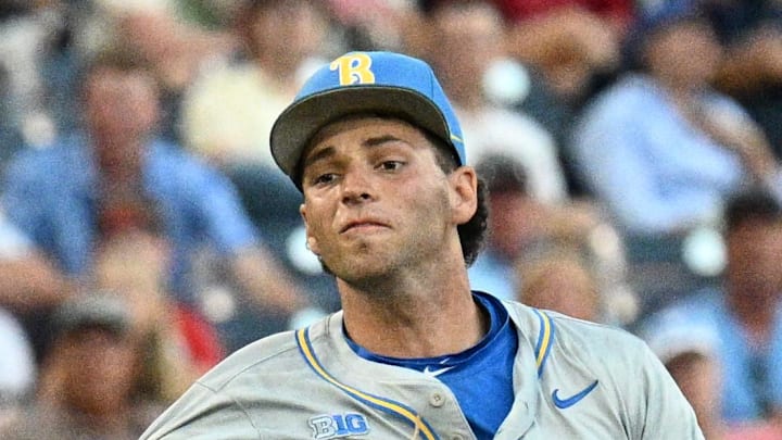 Jun 17, 2025; Omaha, Neb, USA;  UCLA Bruins shortstop Roch Cholowsky (1) throws to first base against the Arkansas Razorbacks during the third inning at Charles Schwab Field. Mandatory Credit: Steven Branscombe-Imagn Images