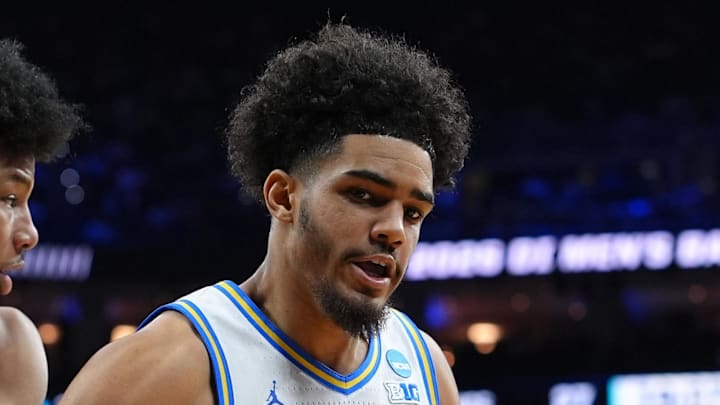 Mar 20, 2026; Philadelphia, PA, USA; UCF Knights forward Jamichael Stillwell (4) grabs a rebound against UCLA Bruins guard Eric Freeny (8) in the second half during a first round game of the men's 2026 NCAA Tournament at Xfinity Mobile Arena. Mandatory Credit: Kyle Ross-Imagn Images Mar 20, 2026; Philadelphia, PA, USA; UCF Knights forward Jamichael Stillwell (4) grabs a rebound against UCLA Bruins guard Eric Freeny (8) in the second half during a first round game of the men's 2026 NCAA Tournament at Xfinity Mobile Arena. Mandatory Credit: Kyle Ross-Imagn Images