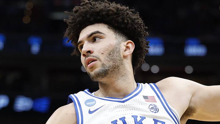 Mar 29, 2026; Washington, DC, USA; Duke Blue Devils forward Cameron Boozer (12) grabs the ball in front of UConn Huskies forward Jaylin Stewart (3) in the first half during an Elite Eight game of the East Regional of the men's 2026 NCAA Tournament at Capital One Arena. Mandatory Credit: Amber Searls-Imagn Images
