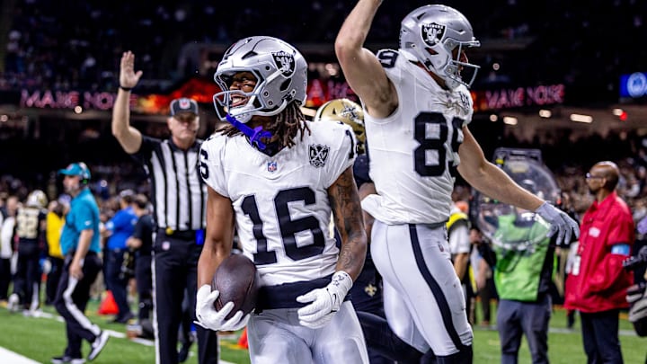 Dec 29, 2024; New Orleans, Louisiana, USA; Las Vegas Raiders wide receiver Jakobi Meyers (16) runs in from a touchdown against New Orleans Saints cornerback Alontae Taylor (1) during the first half at Caesars Superdome. Mandatory Credit: Stephen Lew-Imagn Images Dec 29, 2024; New Orleans, Louisiana, USA; Las Vegas Raiders wide receiver Jakobi Meyers (16) runs in from a touchdown against New Orleans Saints cornerback Alontae Taylor (1) during the first half at Caesars Superdome. Mandatory Credit: Stephen Lew-Imagn Images