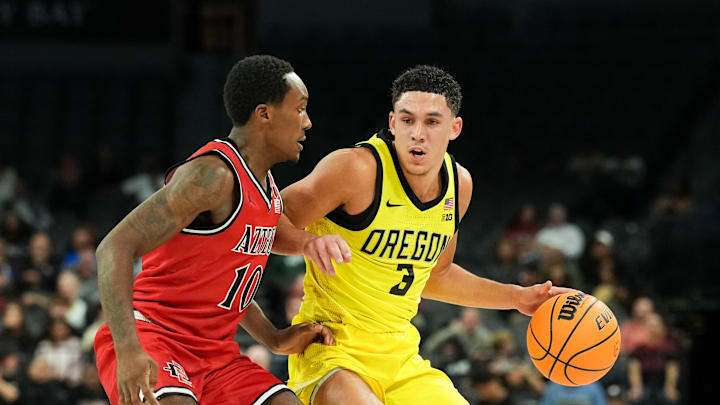 Nov 25, 2025; Las Vegas, Nevada, USA; Oregon Ducks guard Jackson Shelstad (3) drives the ball while San Diego State Aztecs guard BJ Davis (10) defends in the first half in a 2025 Players Era Festival group play game at Michelob Ultra Arena. Mandatory Credit: Kirby Lee-Imagn Images