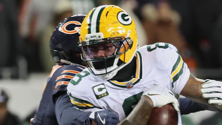 Green Bay Packers running back Josh Jacobs (8) fumbles the ball against the Chicago Bears.