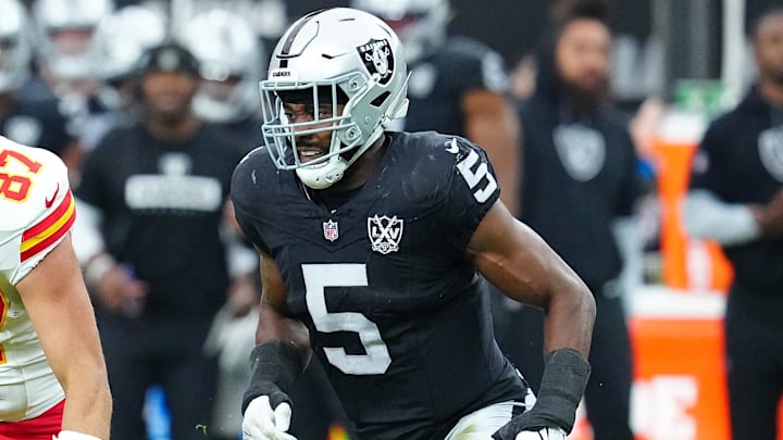 Oct 27, 2024; Paradise, Nevada, USA; Kansas City Chiefs tight end Travis Kelce (87) looks to evade the tackle of Las Vegas Raiders linebacker Divine Deablo (5) during the first quarter at Allegiant Stadium. Mandatory Credit: Stephen R. Sylvanie-Imagn Images Oct 27, 2024; Paradise, Nevada, USA; Kansas City Chiefs tight end Travis Kelce (87) looks to evade the tackle of Las Vegas Raiders linebacker Divine Deablo (5) during the first quarter at Allegiant Stadium. Mandatory Credit: Stephen R. Sylvanie-Imagn Images