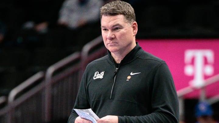 Mar 12, 2026; Kansas City, MO, USA; Arizona Wildcats coach Tommy Lloyd watches game play during the second half against the UCF Knights at T-Mobile Center. Mandatory Credit: William Purnell-Imagn Images