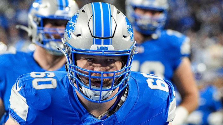 Detroit Lions guard Graham Glasgow (60) warms up before the NFC divisional round at Ford Field in Detroit Detroit Lions guard Graham Glasgow (60) warms up before the NFC divisional round at Ford Field in Detroit
