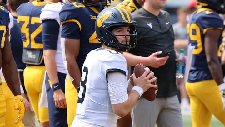 West Virginia University quarterback Nicco Marchiol drops back during a passing drill in the 2024 Gold-Blue Spring Game.