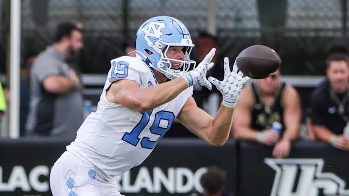 Sep 20, 2025; Orlando, Florida, USA; North Carolina Tar Heels tight end Jake Johnson (19) catches a pass during the second half against the UCF Knights at the Bounce House Stadium. Mandatory Credit: Mike Watters-Imagn Images