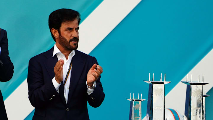 May 8, 2022; Miami Gardens, Florida, USA; Dan Marino and FIA president Mohammed Ben Sulayem applaud during the award ceremony following the Miami Grand Prix at Miami International Autodrome. Mandatory Credit: John David Mercer-Imagn Images