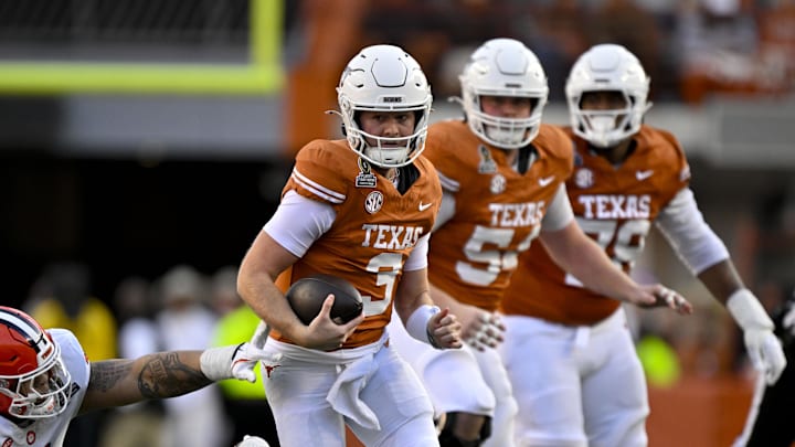 Dec 21, 2024; Austin, Texas, USA; Texas Longhorns quarterback Quinn Ewers (3) and Clemson Tigers defensive lineman Peter Woods (11) in action during the game between the Texas Longhorns and the Clemson Tigers in the CFP National Playoff First Round at Darrell K Royal-Texas Memorial Stadium. Mandatory Credit: Jerome Miron-Imagn Images