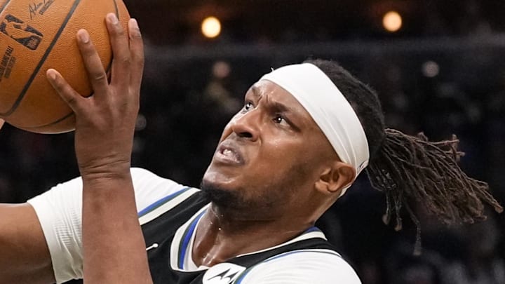 Milwaukee Bucks center Myles Turner (3) shoots around Denver Nuggets forward Aaron Gordon (32) during the second quarter at Fiserv Forum on January 23, 2026.