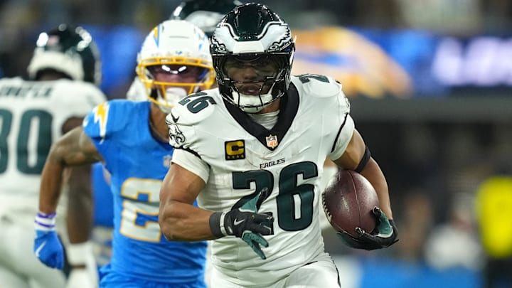 Dec 8, 2025; Inglewood, California, USA; Philadelphia Eagles running back Saquon Barkley (26) runs to score a touchdown against the Los Angeles Chargers in the second half at SoFi Stadium.