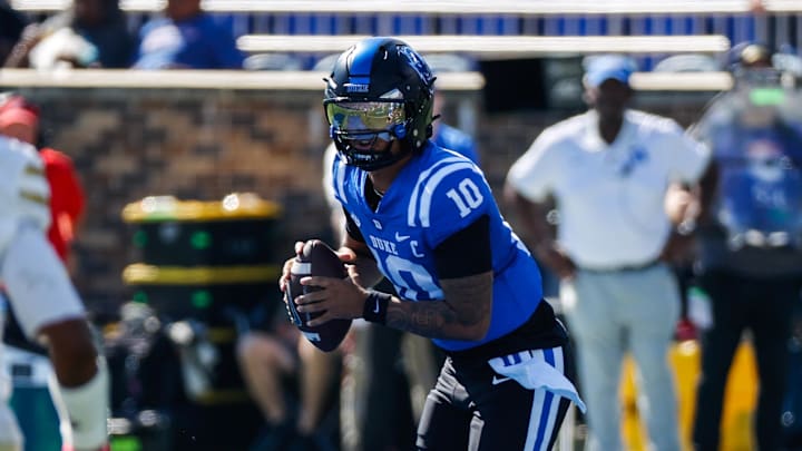Oct 18, 2025; Durham, North Carolina, USA;  Duke Blue Devils quarterback Darian Mensah (10) runs with the ball  during the first half of the game against Georgia Tech Yellow Jackets at Wallace Wade Stadium. Mandatory Credit: Jaylynn Nash-Imagn Images