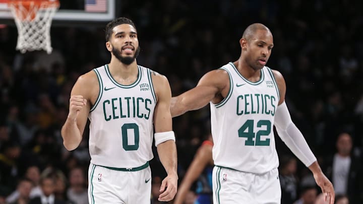 Nov 4, 2023; Brooklyn, New York, USA;  Boston Celtics forward Jayson Tatum (0) and center Al Horford (42) walk back to the bench after the Brooklyn Nets call a time out in the fourth quarter at Barclays Center. Mandatory Credit: Wendell Cruz-Imagn Images