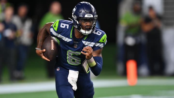 Seattle Seahawks QB Jalen Milroe carries the ball against the Las Vegas Raiders during the second half at Lumen Field.